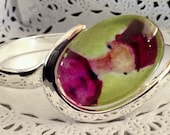 1 beautiful Bracelet with whimsical 1 in round image on the pad. This is a bracelet made of copper and bronze plated.