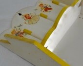 Vintage sewing rack with shelf for thread and adorable decals