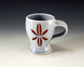 Curvy pale blue mug with mod design