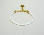 Delicate adjustable nautical white rope bracelet with gold anchor or ship wheel charm