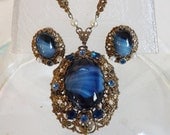 Memorial Day Sale Vintage West Germany blue art glass filigree levaliere necklace and earrings set with blue rhinestones and pearls