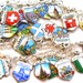 Travel Charm bracelet, Sterling silver with 25 enamel shields.
