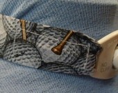 Trach tie-band  - Golf balls and tees