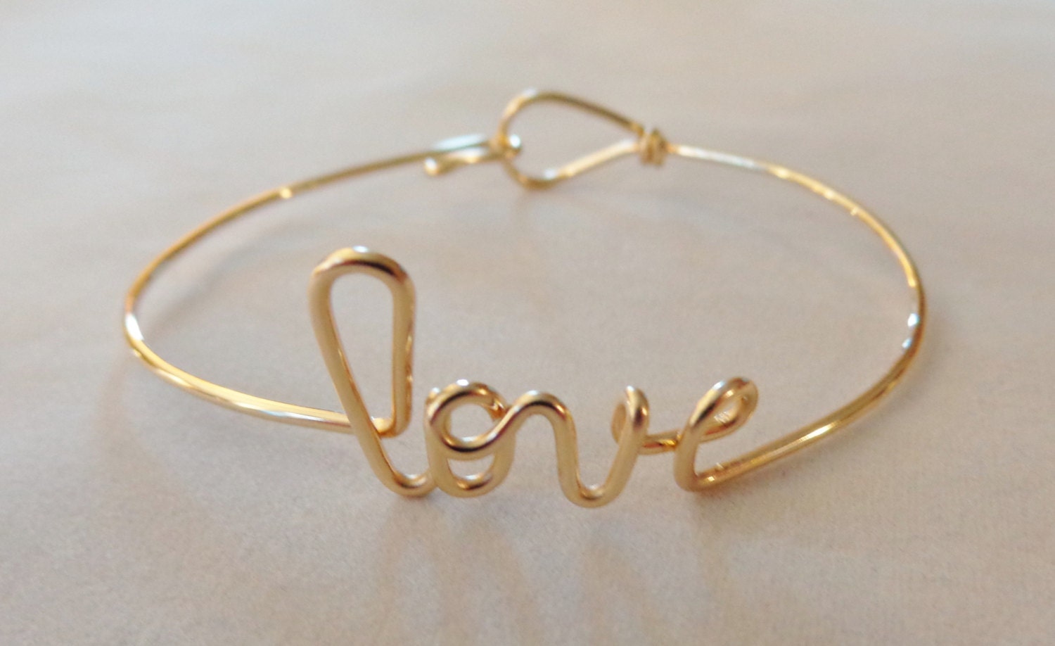 Gold love bracelet, graduation gift