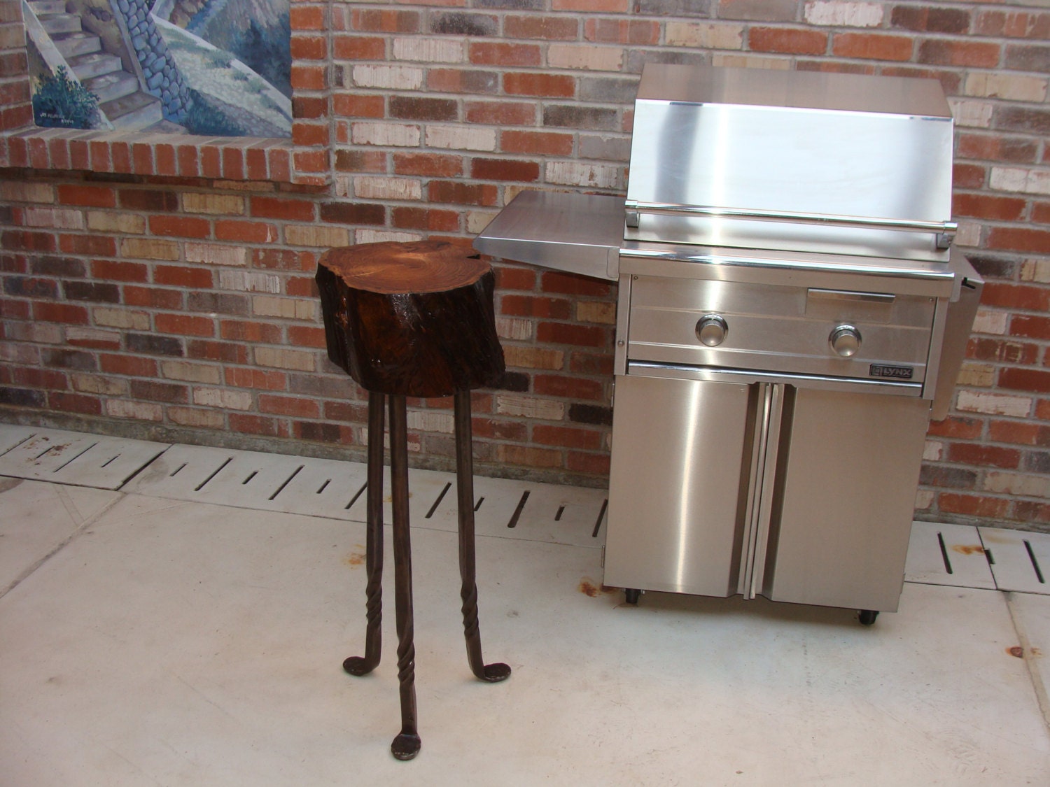 Mesquite end grain chopping block on hand forged legs