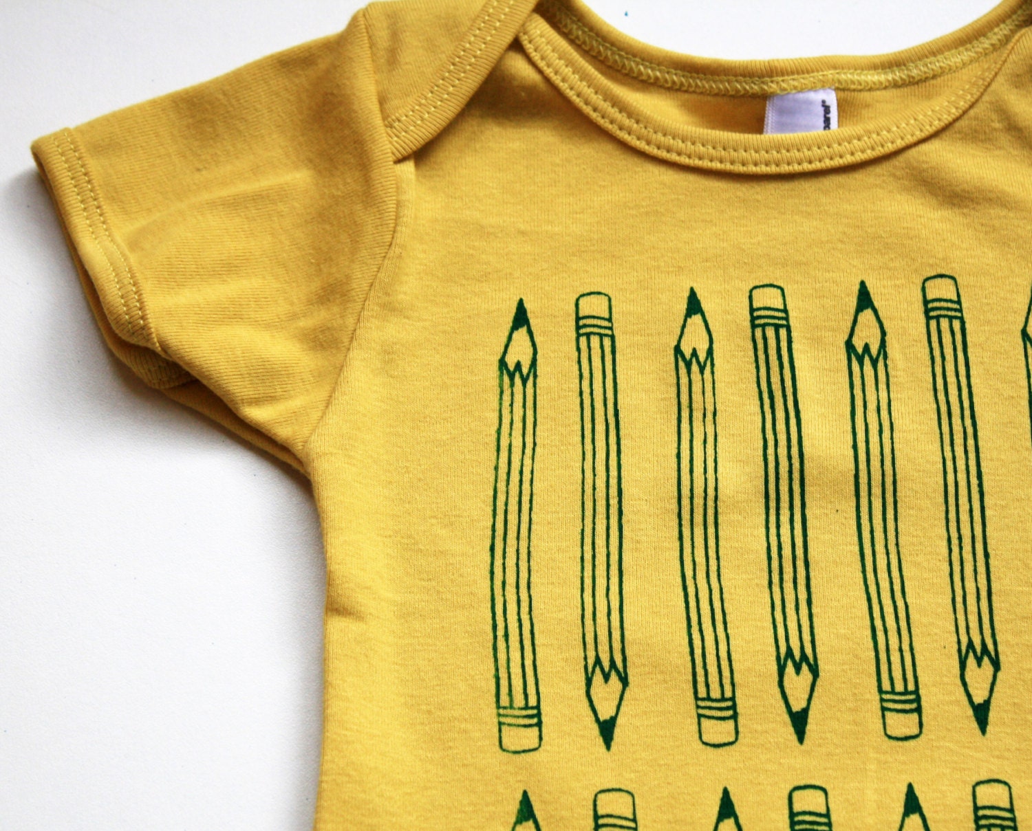 Pencilvania- Organic Cotton - mustard baby bodysuit - pencil pattern screenprint