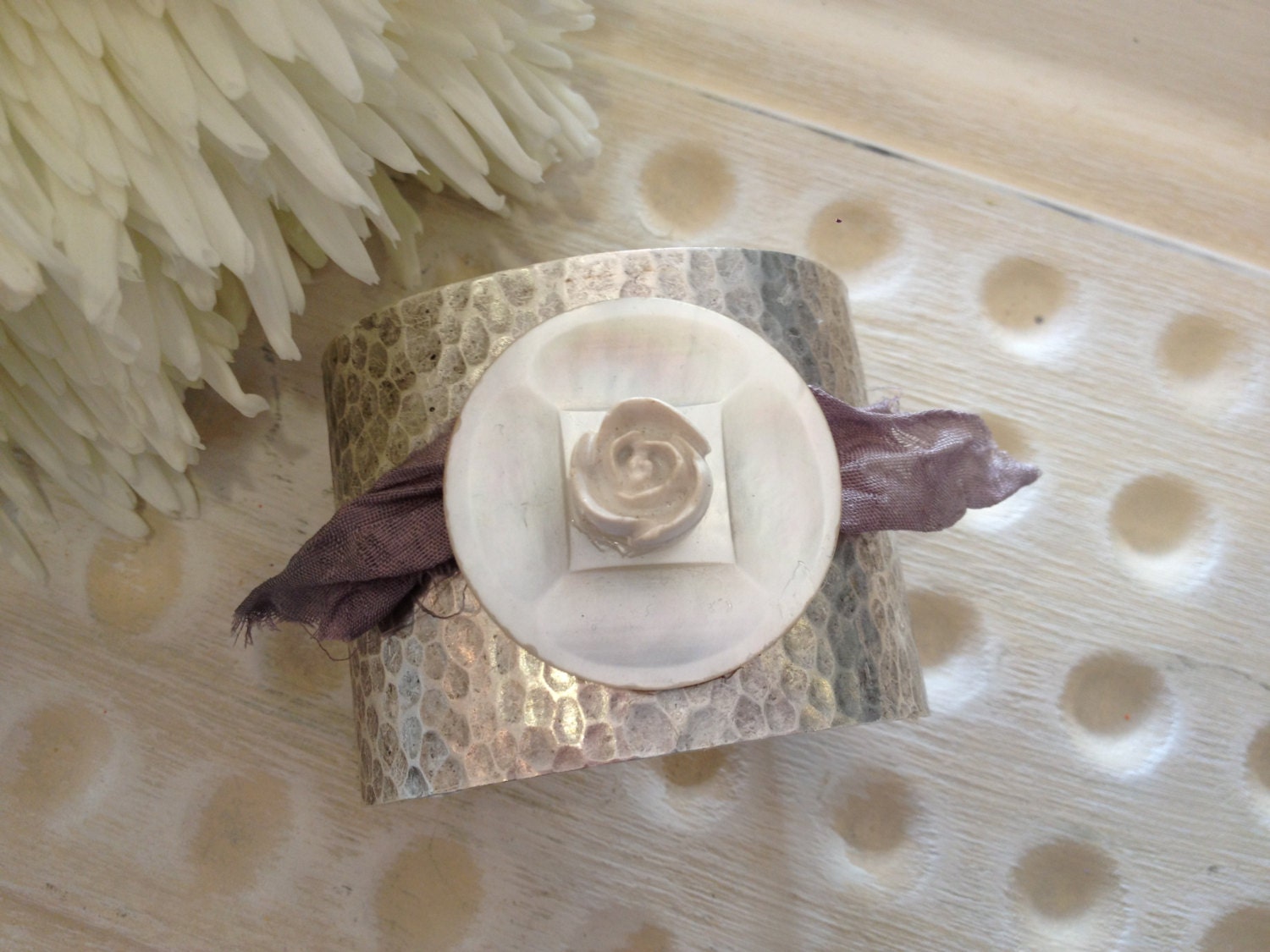 Silver textured cuff bracelet with large pearlized vintage button, vintage flower button and sari silk ribbon