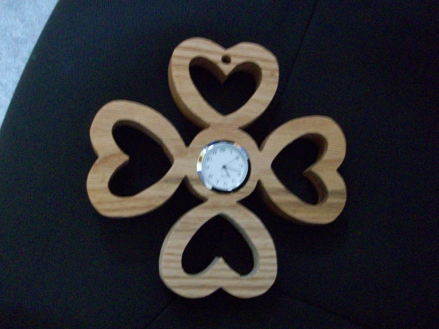 Wooden four heart wall clock