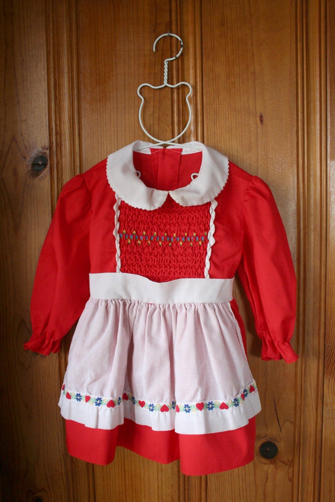 vintage little girl's red and white pinafore style dress