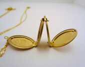 Long locket necklace. Accordion style locket, four spots for photos. Gold necklace, floral design. Friendship necklace, best friend gift.
