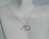 Sterling Silver Eclipsed Hearts Pendant Necklace with Pink  Cubic Zirconia Stone
