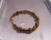 Easter Egg ( Gold Pewter textured bead bracelet)