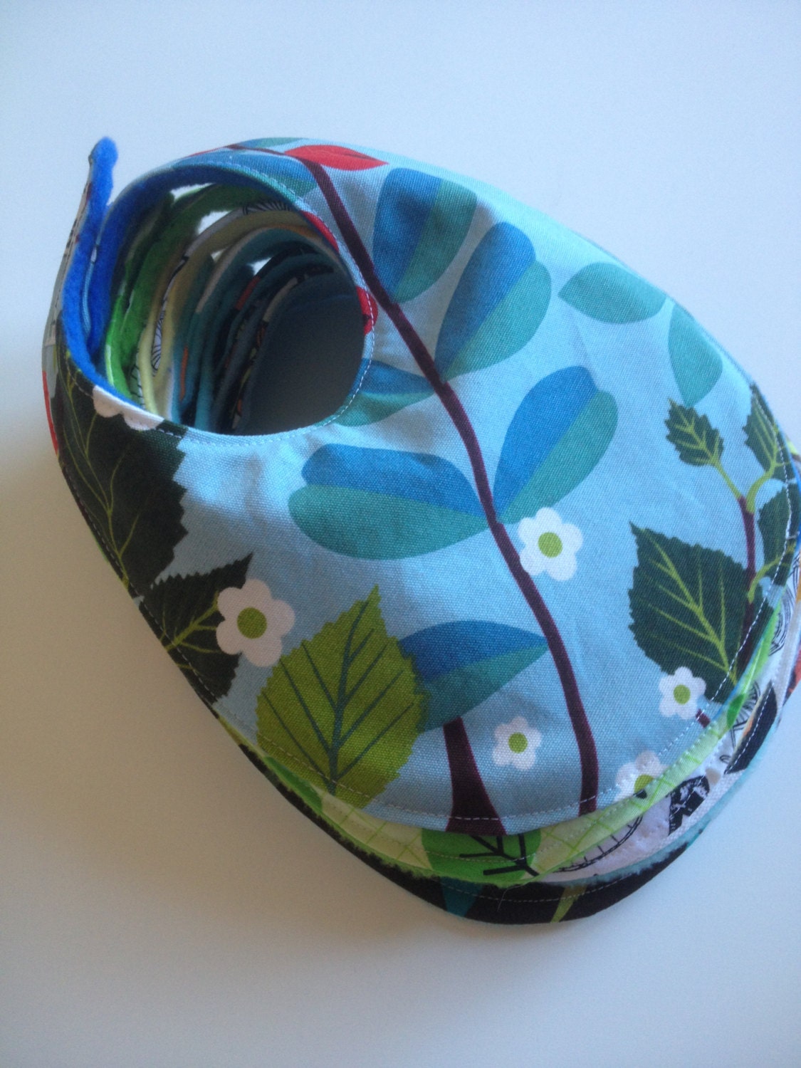 Small Bib in Ikea Leaves and Berries Fabric with Blue Fleece Backing