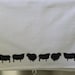 Black sheep on white cotton tea towel