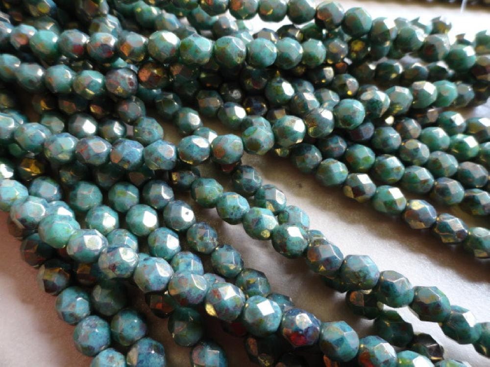 6mm Turquoise with Bronze Picasso Finish Round Faceted Beads