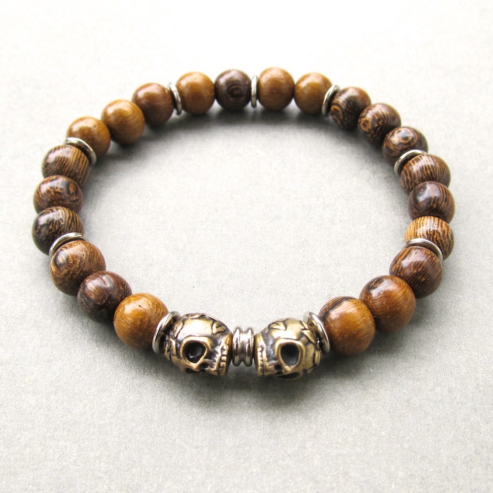 Mens brown robles wooden beaded stretch bracelet with double brass oxide skull beads