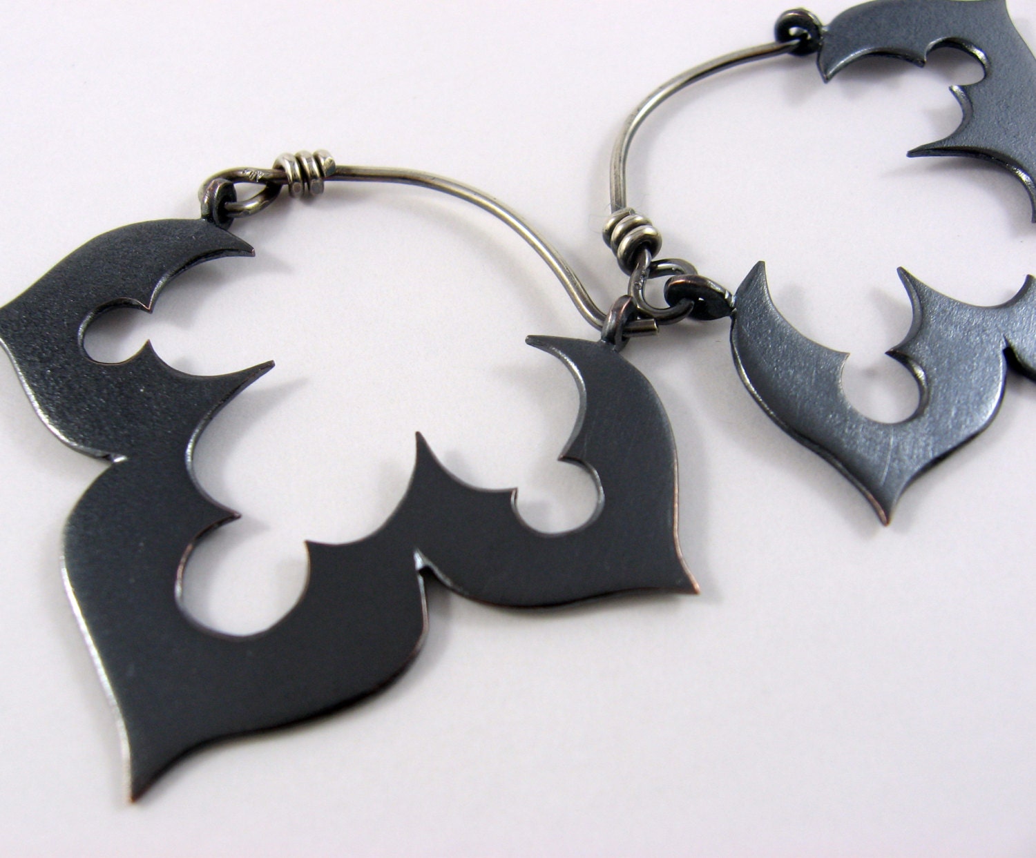 Genie's black lotus earrings in copper and sterling