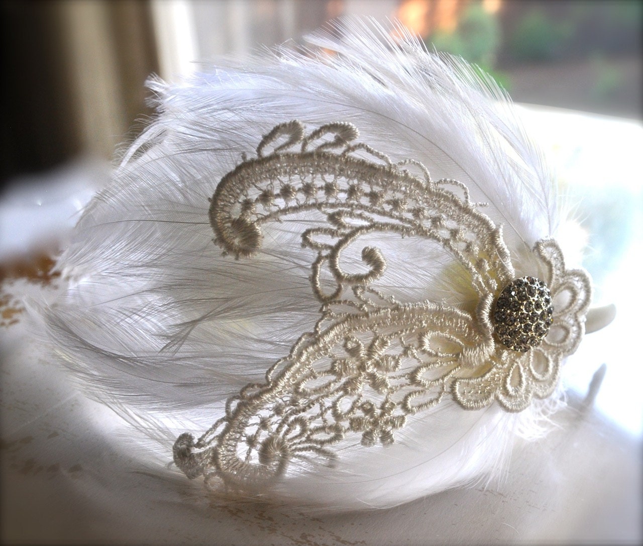 Off white and cream feather fascinator headband. A chic classic with a touch of lace.
