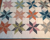 Star Lap or Baby Quilt in Fancy Free fabrics -- blue, orange, pink, cream, green- pattern also available