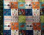 Safari Soirée Organic Cotton Baby Crib Quilt -- lion, elephant, blue, orange, grey, chevron