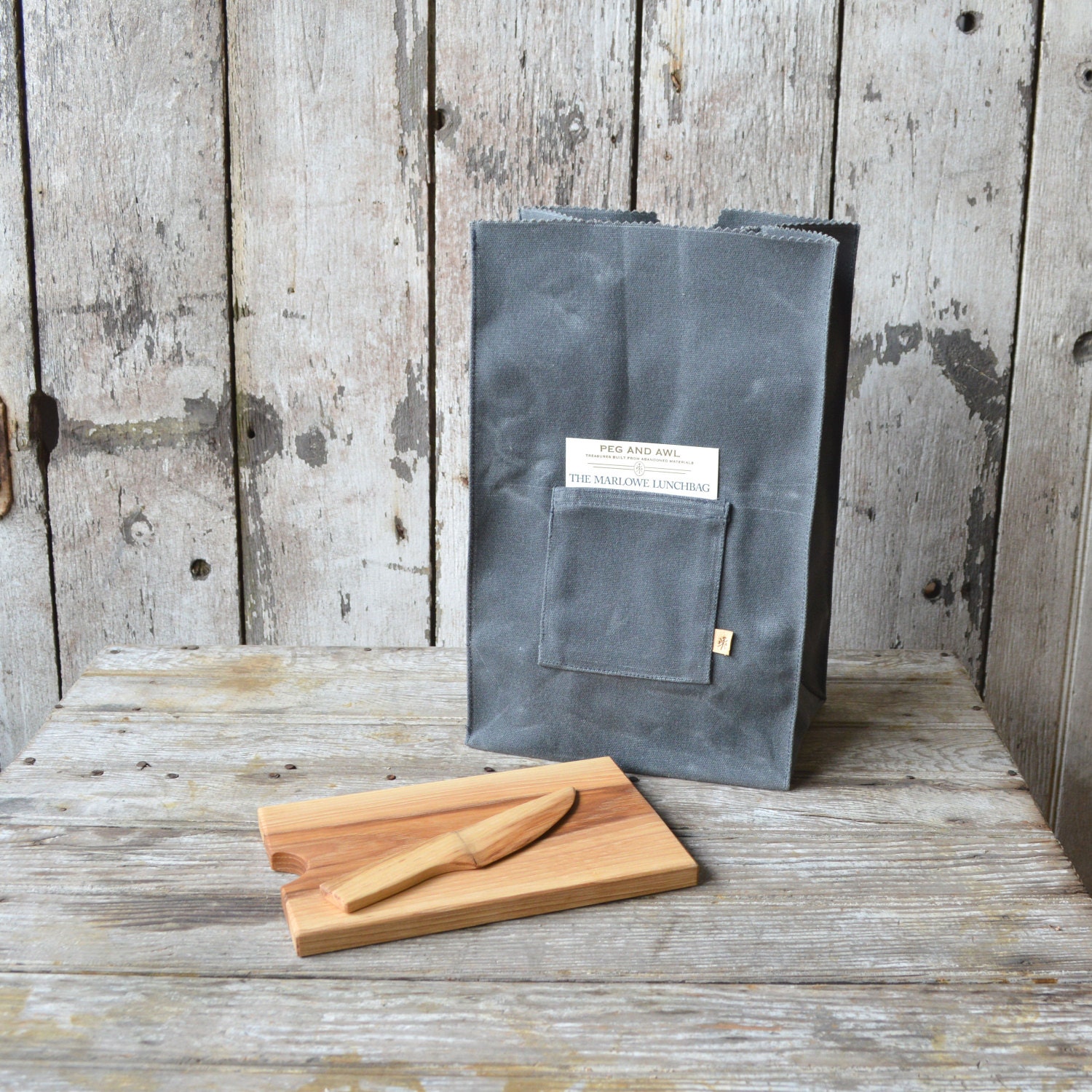 The Marlowe Lunchbag with Cheese Palette and Knife, waxed canvas, reclaimed wood.