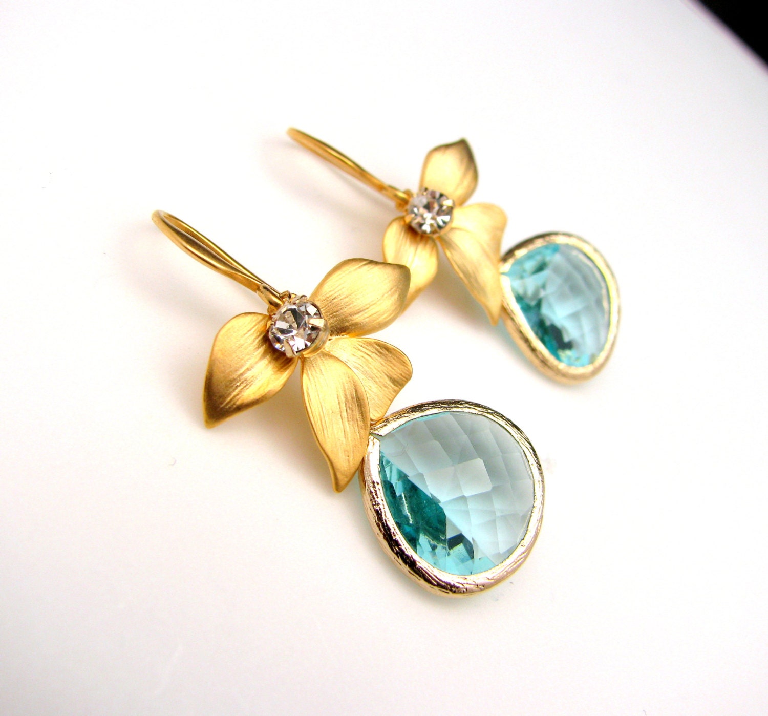 aqua faceted teardrop bezel crystal on gold plated hook with orchid flower