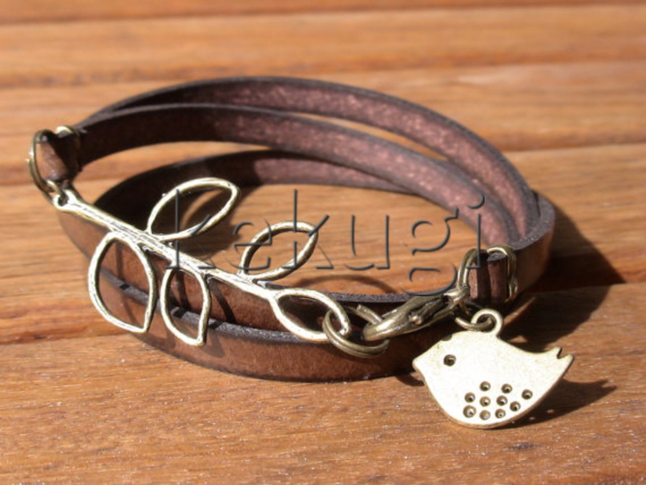 multi wrap dark brown togo flat leather bracelet with brass leaf connector and bird