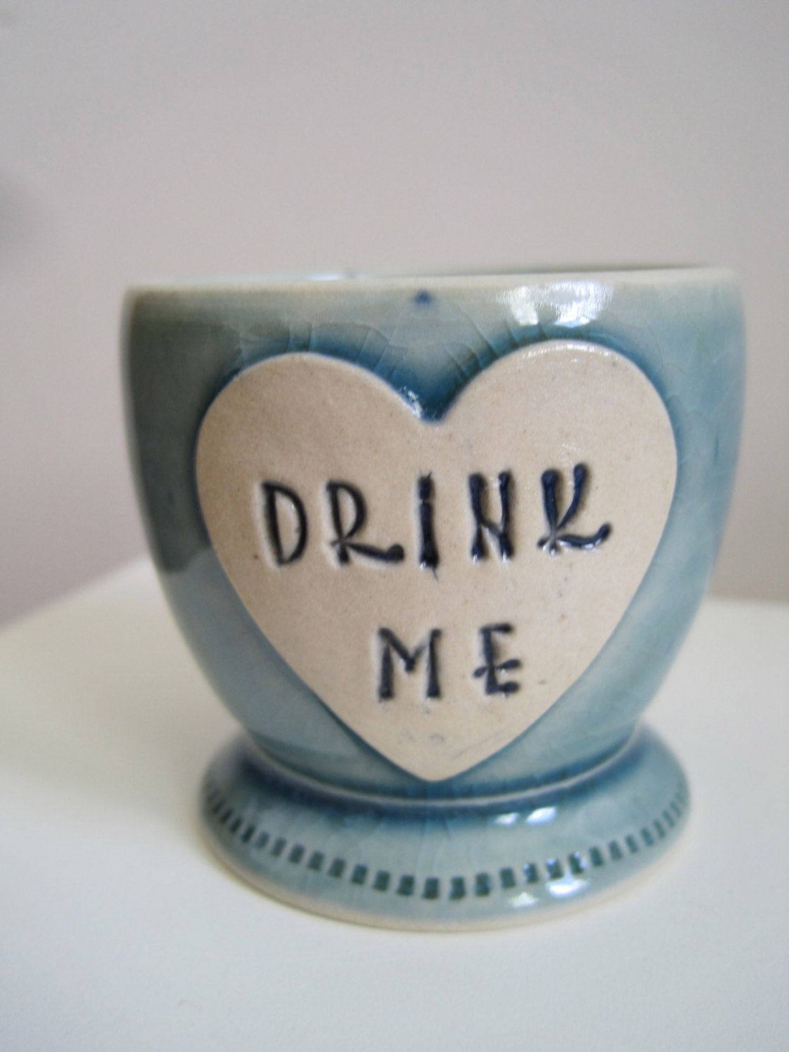 Alice in Wonderland Shot Glass 'Drink Me' heart shaped stoneware Frosty blue