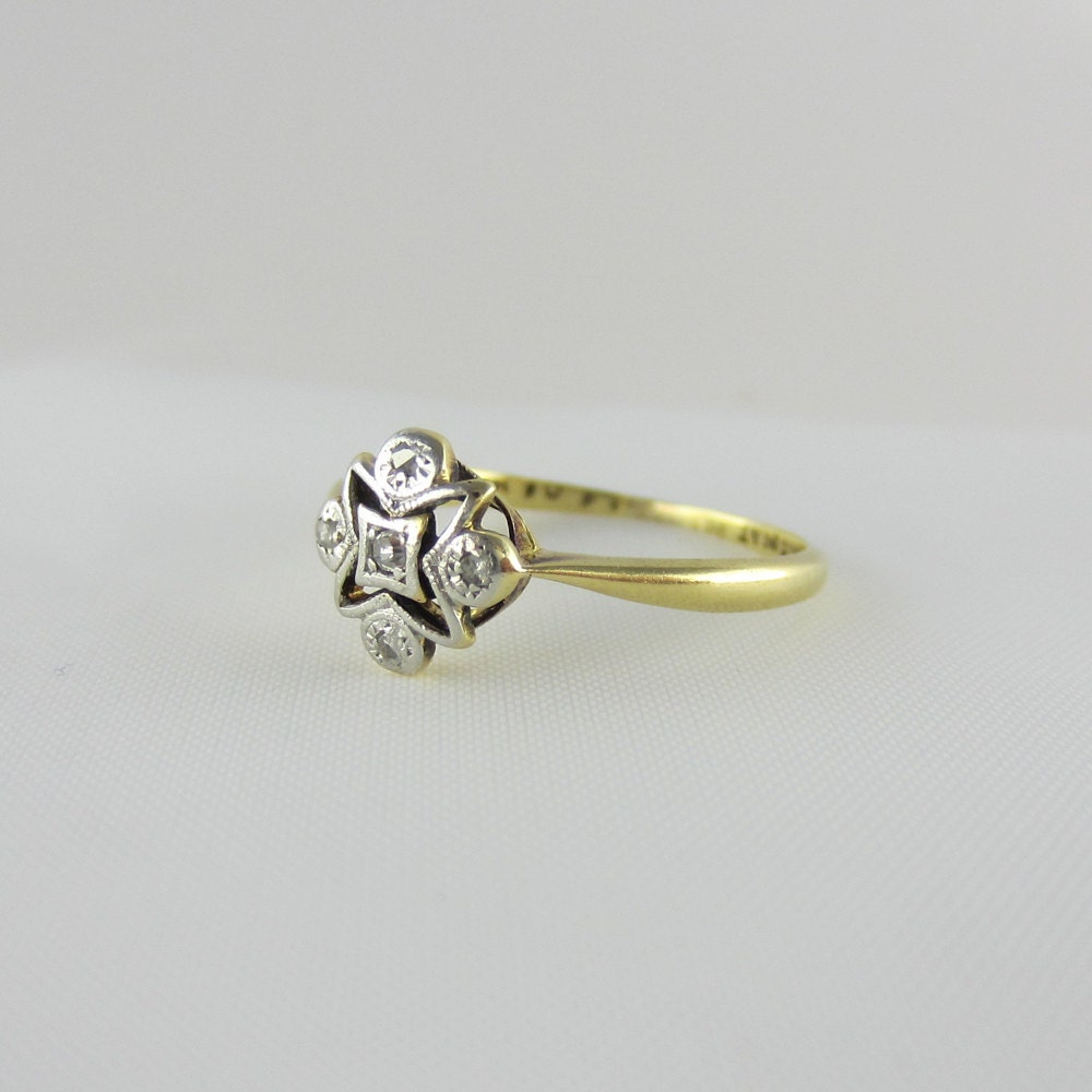 Art Deco Diamond Ring. Star Design in Platinum and Gold, Circa 1920s.