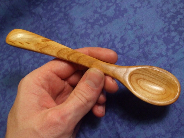 Hand carved eating spoon in figured cherry wood
