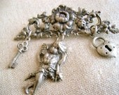 vintage cherub and lock/key brooch