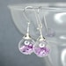 Lavender color tinsel glitter in hand blown glass ball earrings.