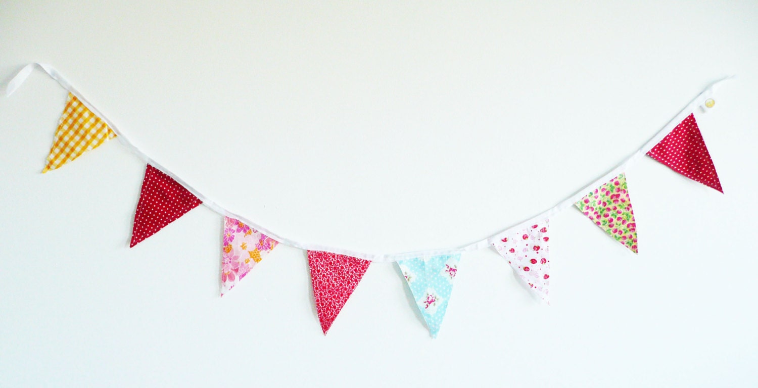 Pretty Cloth Bunting Garland in pink, red, yellow blue and white.