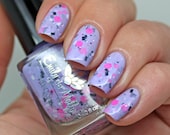 Nail polish - "Block Party" neon pink and black and white glitter in a purple base