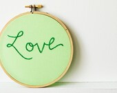 Embroidery Hoop Art. "Love" Mint, Green. Embroidered Text on Fabric. Stitched by merriweathercouncil