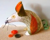 Retro mouse in a 60s vintage fabric  of  orange seed head barkcloth