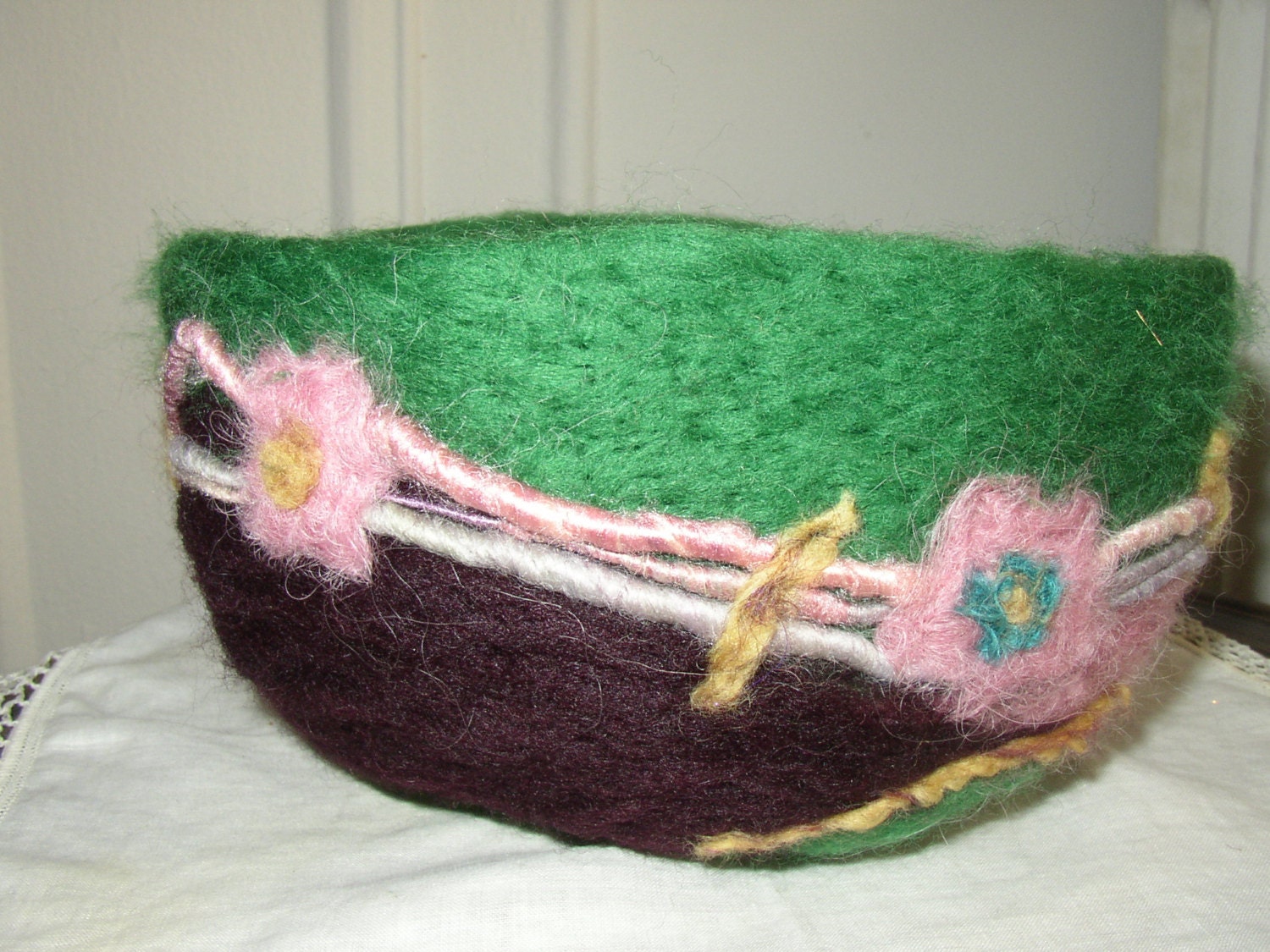 playing with color, a green, purple, and pink needle felted wool bowl