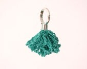 silver ring with crochet flower in emerald green