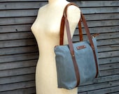 Waxed canvas bag/ carry all with  leather handles and zipper closure  COLLECTION UNISEX