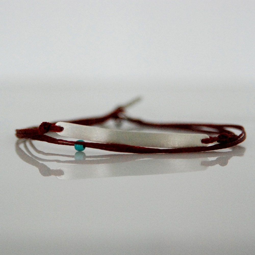 Layered friendship bracelet on burgundy cord