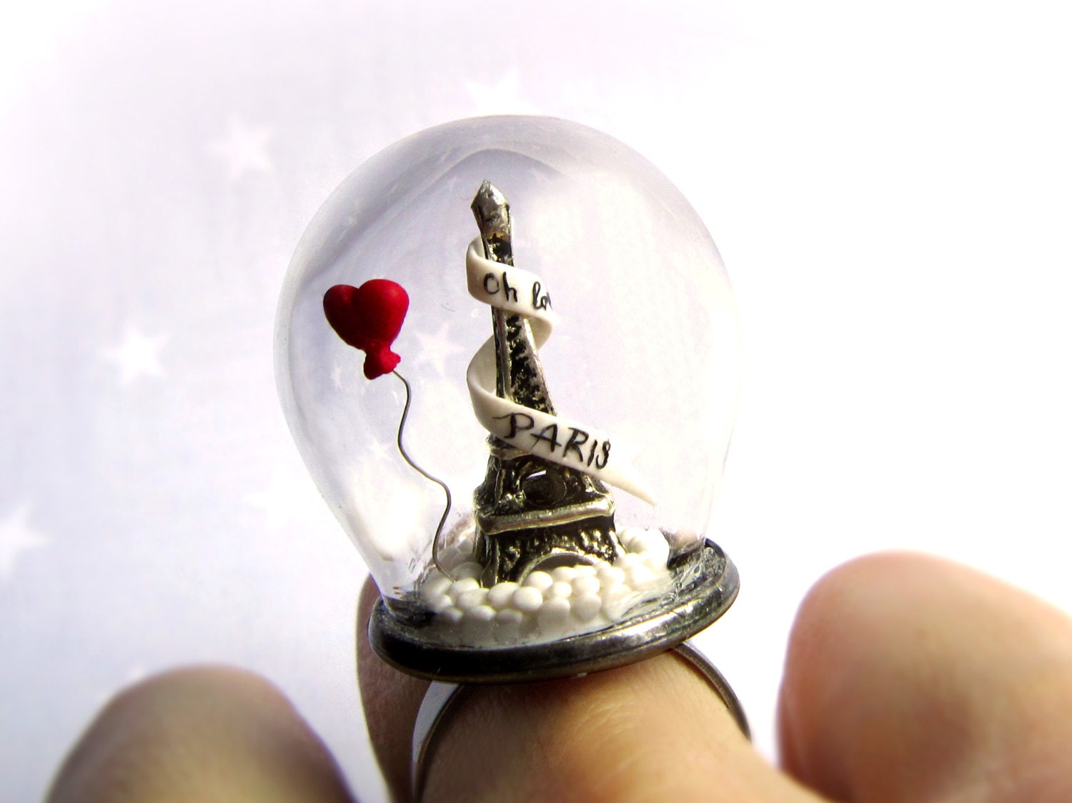 Ring Oh la la Paris with Eiffel Tower and red heart balloon. Ring glass globe