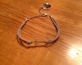 Metallic grey cross bracelet