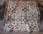 Twin size patchwork bed quilt in floral pastels, a beautiful children's quilt