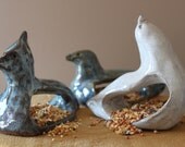Hand scuplted bird feeders, dove or cardinal in blue float or white