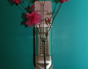 floating vase made from recycled wine bottle and repurposed wood