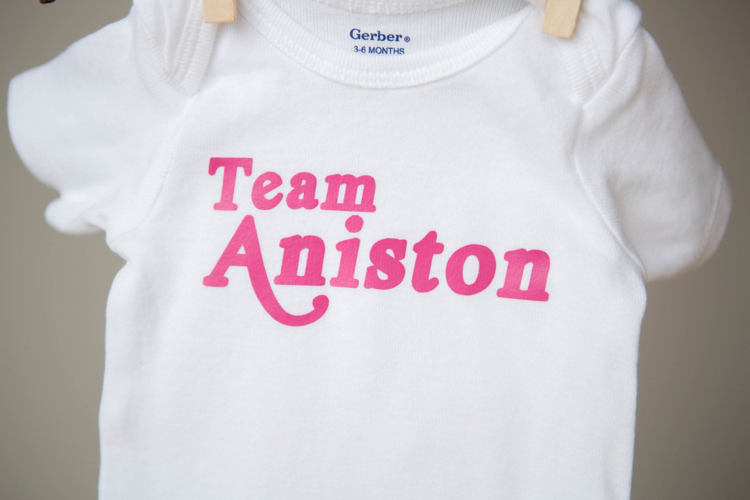 Short Sleeve "Team Aniston" Onesie, 0-3 Months, 3-6 Months, 6-9 Months, 12 Months, 18 Months, 24 Months