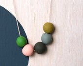 not quite round handmade beads make a necklace