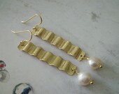 Handmade wavy brass with fresh water pearls earrings .