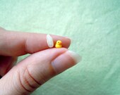 Micro rubber duck in a tiny bottle