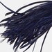 24cm piece of Navy Goose Biots on a fringe - approx 40-50 feathers